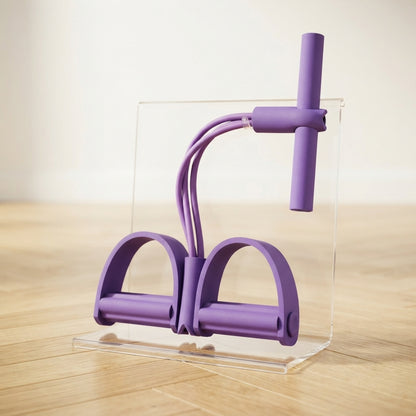 Élastique musculation violet avec pédales installé sur présentoir plexiglas transparent.