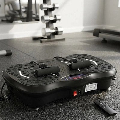  Plateforme vibrante noire dans une salle de sport avec haltères.